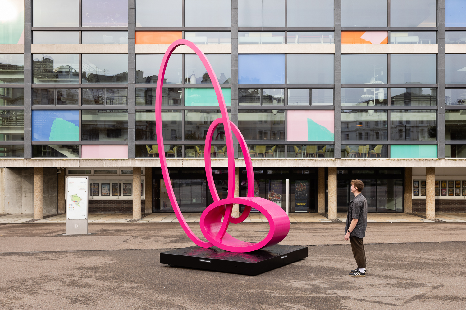 Nigel Hall's sculpture on the Devonshire Plaza, consisting of three ovoid shapes balancing together in pink metal.