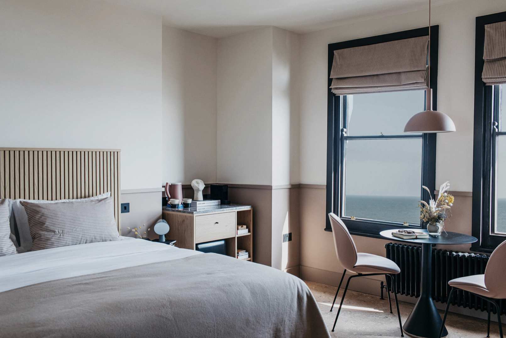 A modern hotel room with a view of the sea